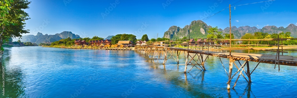 Beautiful view of a bamboo bridge. Laos landscape. Panorama - obrazy, fototapety, plakaty 