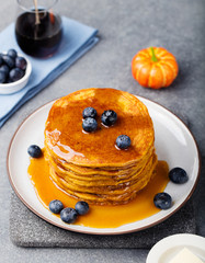 Wall Mural - Pumpkin pancakes with maple syrup and blueberries