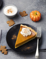 Wall Mural - Pumpkin pie, tart with whipped cream on a plate.
