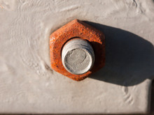 Close Up Of Large Rusty Bolt And Screw Head