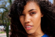© mimagephotos - close up portrait of beautiful young black woman staring