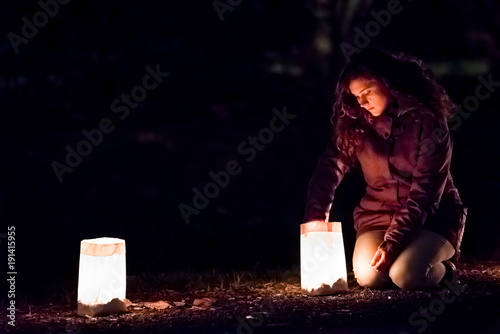 One Young Woman Lights Up With Match Stick Eve Candle One Young Woman Lights Up With Match Stick Eve Candle Light Lantern In