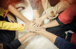 © smolaw11 - Unity and teamwork Concept: Group of friends hands together. Top view of Asian young people putting their hand together as Friends to stack of hands show teamwork, uninty to activities success in life