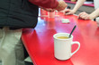 © Ruben - Cup of coffee on a bar table.