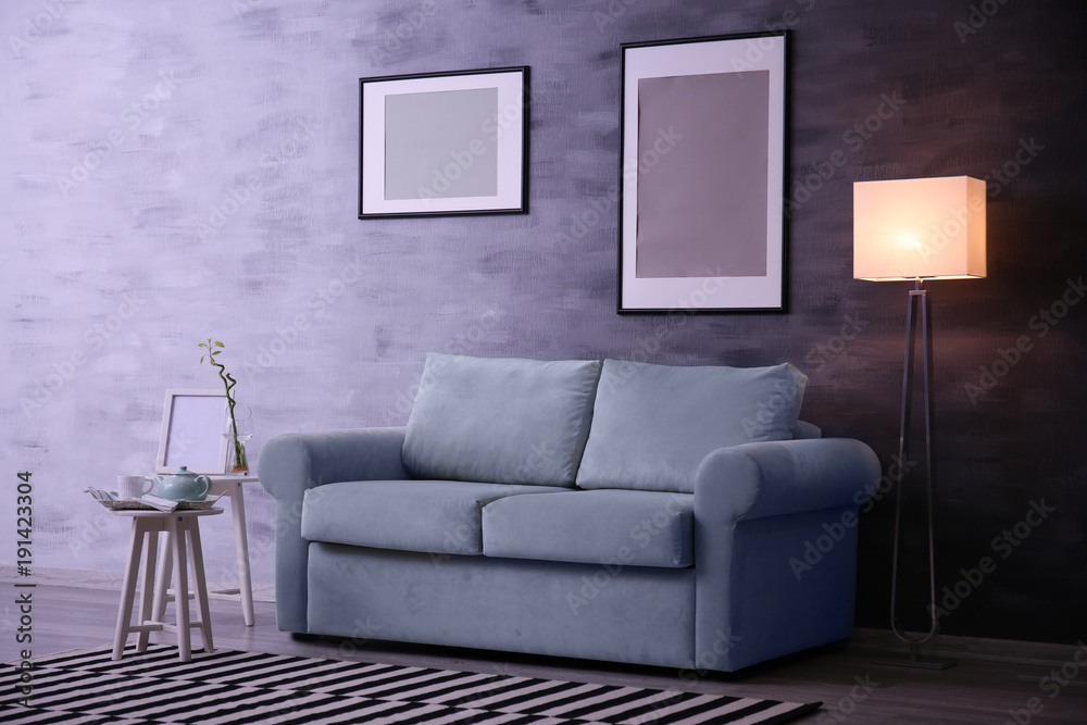 Beautiful trendy room interior with comfortable sofa