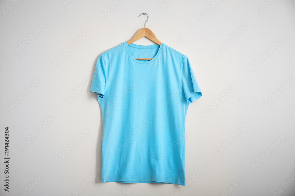 Color t-shirt on light background. Mockup for design