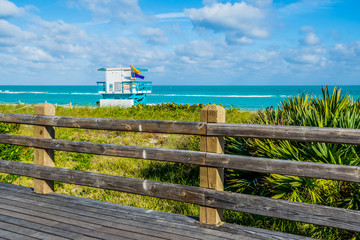 Wall Mural - On a wooden pier to lifeguard stand of Miami beach Florida