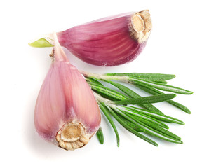 garlic with rosemary leaves isolated on white background. Top view