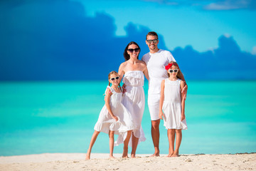 Young family on vacation on caribbean beach