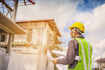 Asian business man construction engineer worker at house building site