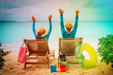 Wall Mural - happy couple relax on a tropical beach