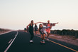 © Criene Images - Happy group of friends riding skateboards together and having fun
