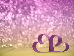  valentines. wedding concept. heart bokeh. couple of pink hearts on pink and yellow bokeh in shape of hearts background