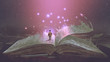 Leinwandbild Motiv Boy standing on the opened giant book with fantasy light, digital art style, illustration painting
