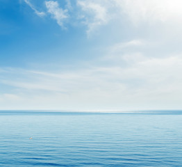 blue sea and sky with clouds
