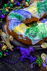 Wall Mural - king cake surrounded by mardi gras decorations