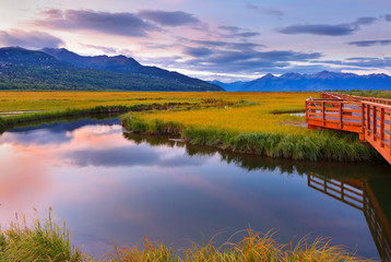 beautiful sunrise at potter marsh wildlife viewing boardwalk, anchorage, alaska. potter marsh is loc