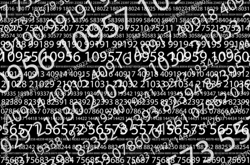 Fotografía Abstract background image of a set of consecutive five-digit white numbers of different sizes on a black background in a diagonal direction