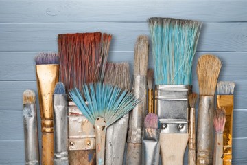 Artist paint brushes and paint cans