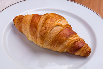 Wall Mural - The classic croissant on a white plate