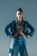 © LIGHTFIELD STUDIOS - attractive woman posing in trendy denim clothes, isolated on grey