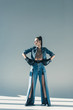 © LIGHTFIELD STUDIOS - fashionable girl in denim clothes and boxing gloves