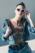 © LIGHTFIELD STUDIOS - stylish model posing in denim clothes and sunglasses