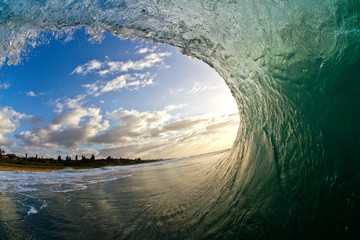 sunrise view from inside a barreling wave