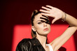 © LIGHTFIELD STUDIOS - attractive fashionable girl gesturing and posing for fashion shoot on red