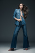 © LIGHTFIELD STUDIOS - attractive sexy girl posing in denim clothes, on grey