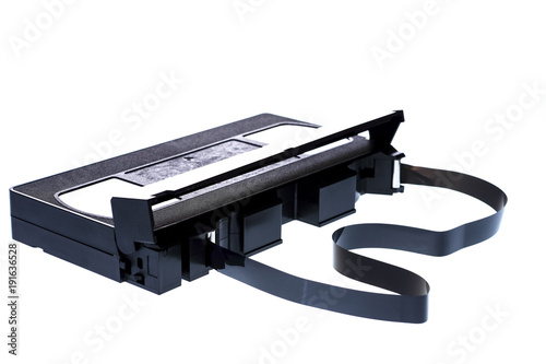 Fotografia, Obraz Video cassette with the tape pulled out isolated on a white background