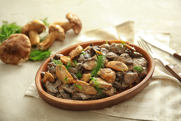 Wall Mural - Plate with delicious mushrooms and meat on table