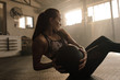 © Jacob Lund - Woman working out in gym using medicine bal