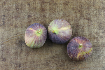  figs (Ficus carica) on a grungy metal background