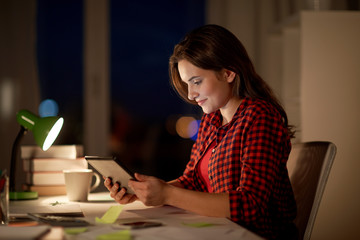 Poster - student girl or woman with tablet pc at night home