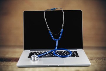 Wall Mural - Laptop diagnosis with stethoscope