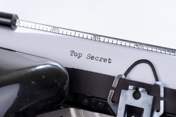 Fototapete - Old retro typewriter with the written text Top Secret