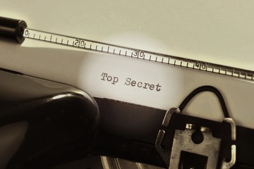 Fototapete - Old retro typewriter with the written text Top Secret