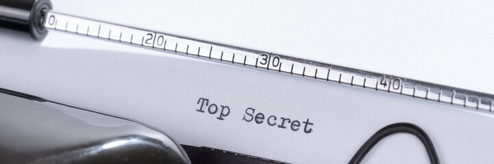Fototapete - Old retro typewriter with the written text Top Secret