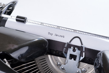 Fototapete - Old retro typewriter with the written text Top Secret