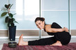 © alex_shifer - sports model girl doing asanas. beautiful brunette practicing yoga in the interior