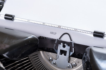 Fototapete - Help written with black ink on a old retro typewriter