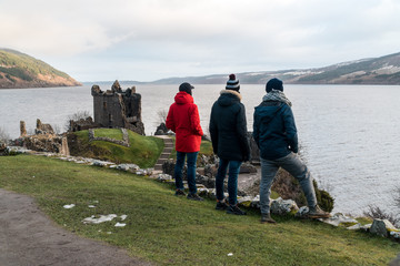 Wall Mural - People admiring Urquhart castle, Loch Ness