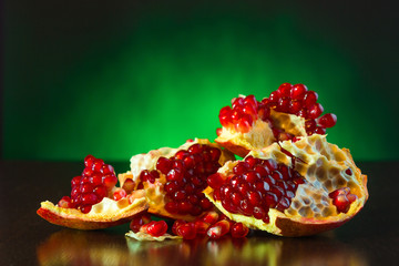 Wall Mural - Ripe juicy fruit of the broken pomegranate