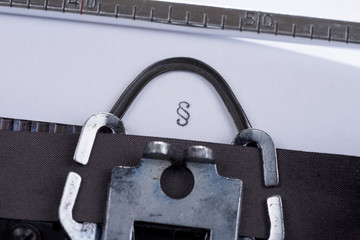 Fototapete - paragraph symbol written on an old retro typewriter
