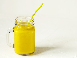 Poster - Banana Mango Smoothie in mason jar. Healthy vegan eating.