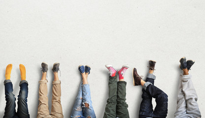 People's legs at the wall during a break in work