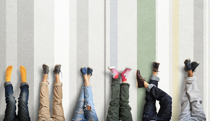 Wall Mural - People's legs at the wall during a break in work