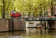 Mini Car crossing a Bridge in Amsterdam canal, Netherlands
