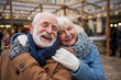 © Yakobchuk Olena - We are so happy together. Portrait of glad old loving couple hugging with fondness. They are standing on street and smiling